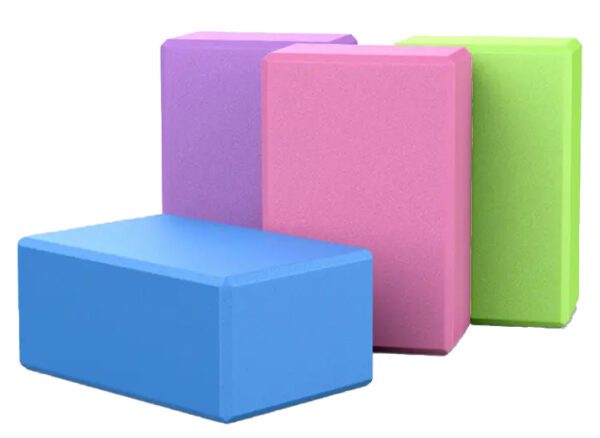 purple, pink, green, and blue foam yoga blocks